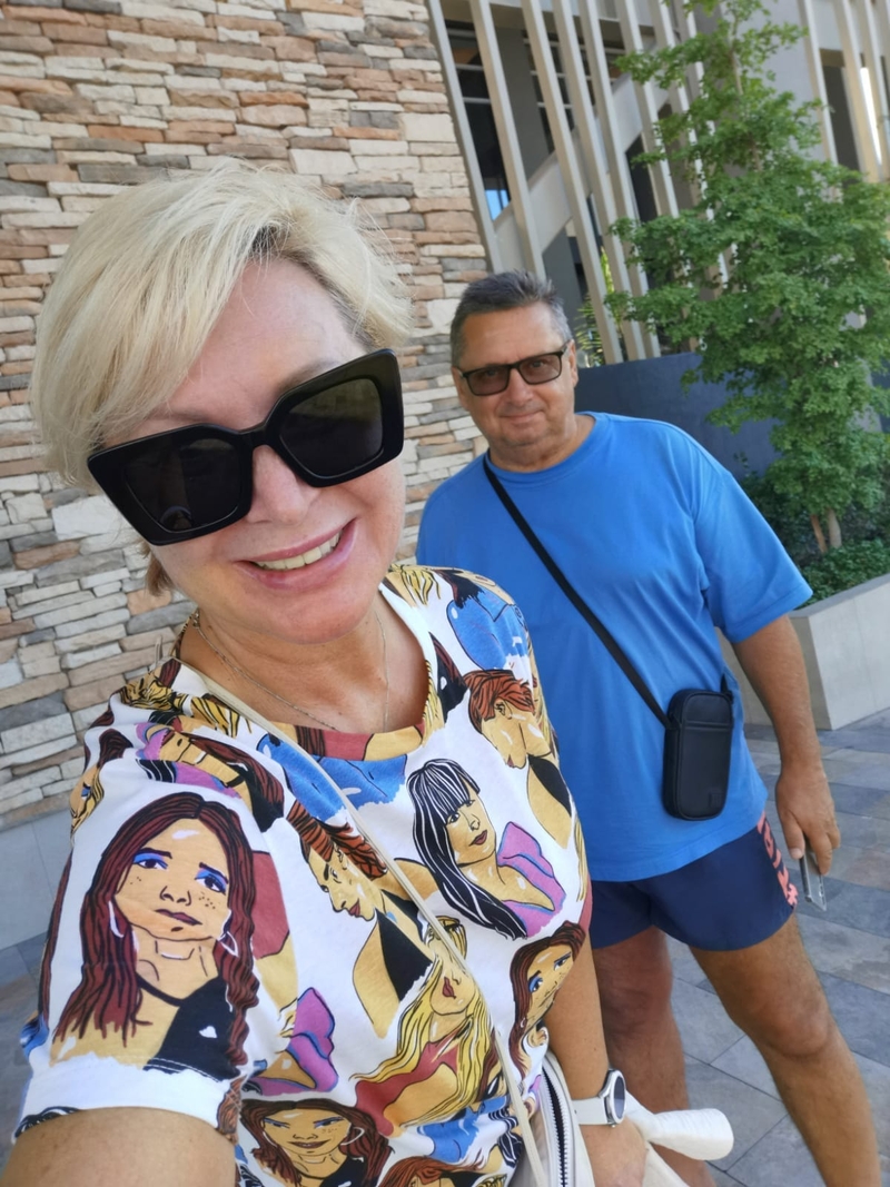 Svetlana and Alexey Demin take a photo of themselves in Mexicali, Mexico