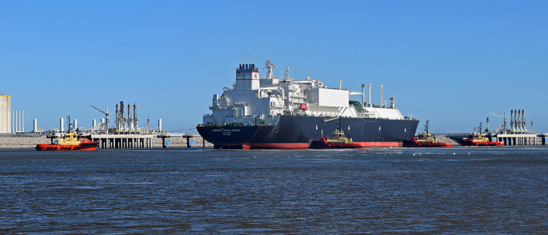 An LNG tanker gets a tugboat escort near the Venture Global Calcasieu Pass LNG export terminal in Cameron Parish.