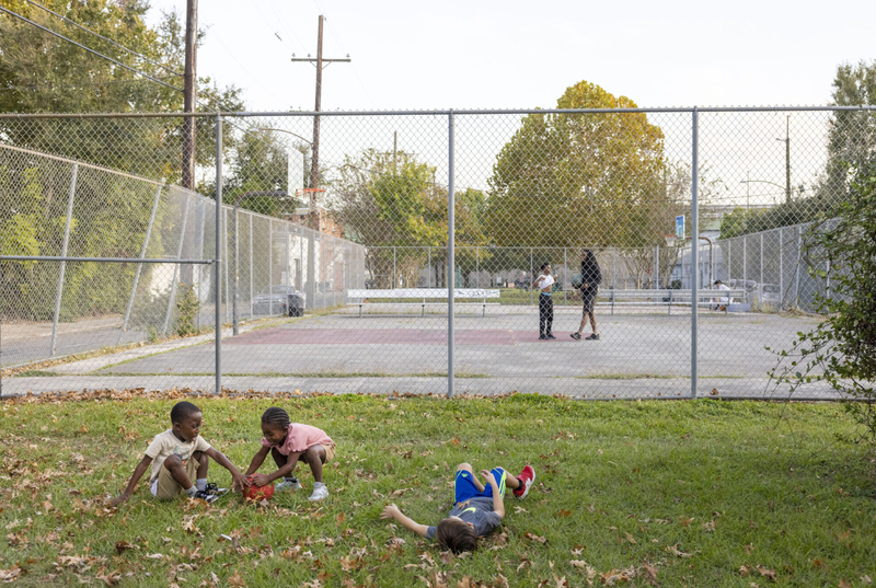 Twins Justice and Jamar Johnson, 6, play in the grass with Stevie Irish, 5, at Soraparu Playspot in the Irish Channel neighborhood of New Orleans