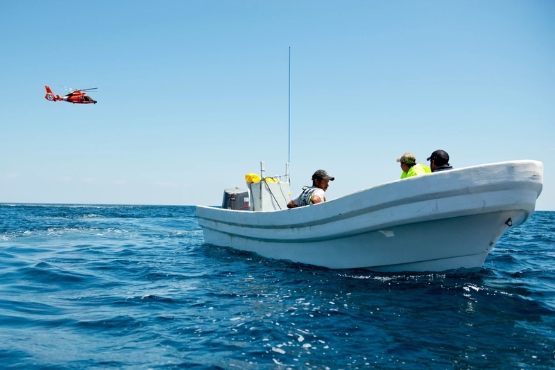 Coast Guardsmen from Station South Padre Island, Texas, catch and detain Mexican nationals aboard a lancha after crews in Coast Guard aircraft spotted them fishing illegally in U.S. territorial waters Friday, May 1, 2015. One of the men has been caught and deported more than 15 times and had warrants out for his arrest. (U.S. Coast Guard photo by Petty Officer 1st Class Andrew Kendrick)
