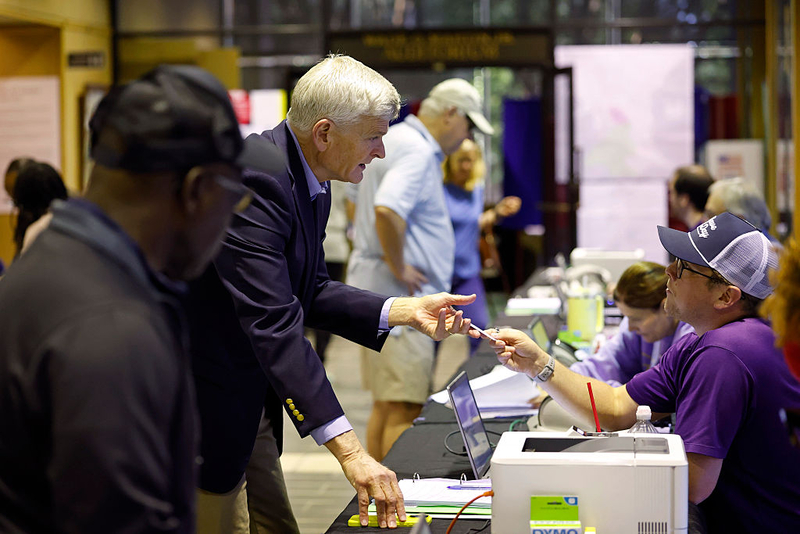 U.S. Sen. Bill Cassidy checks in before casting his ballot on the first day of early voting at the Louisiana State Archives on May 2, 2026, in Baton Rouge.