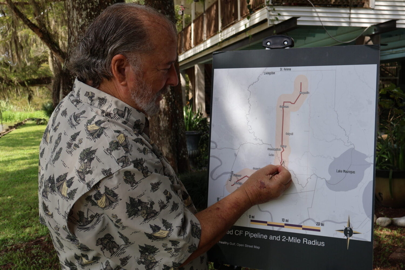 Man points to a map of pipeline.