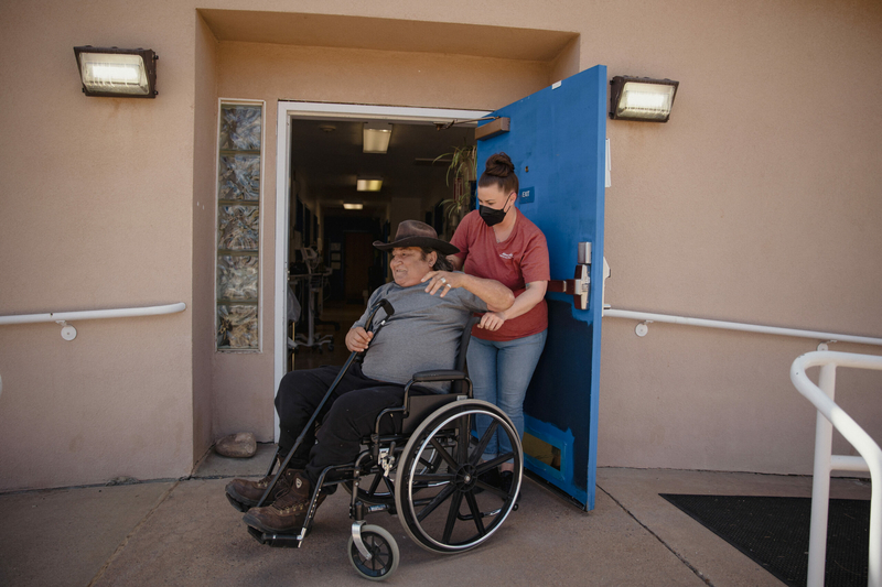 David Martinez is pushed in a wheel chair