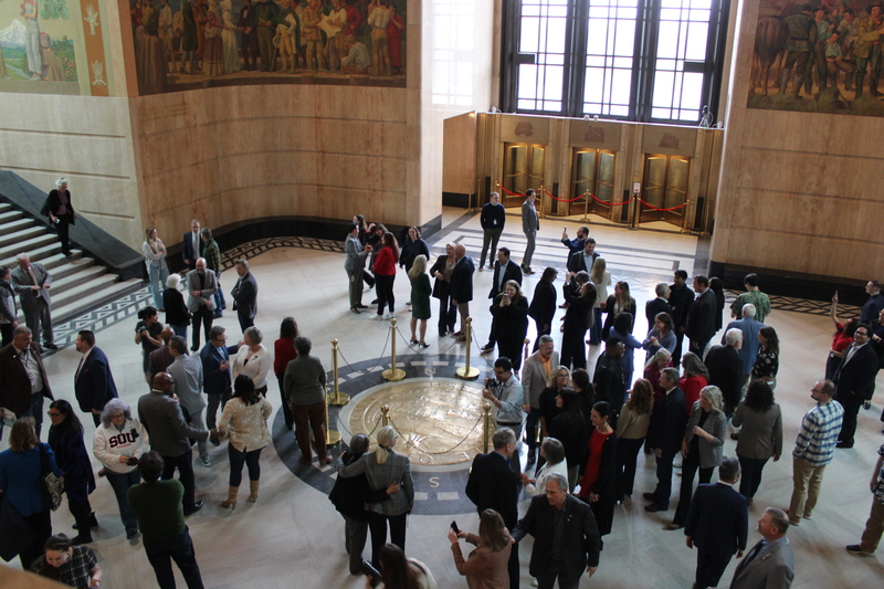 Lawmakers meet in the Rotunda of the State Capitol on Friday, March 6, 2026 following the end of the 2026 legislative session. (Photo by Julia Shumway/Oregon Capital Chronicle)