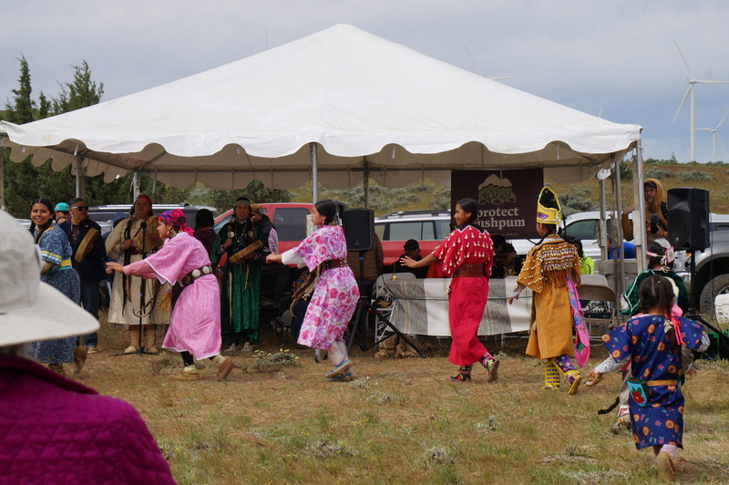 Youth from the Yakama Nation perform the Swan Dance near Pushpum, a site sacred to Columbia River tribes near Goldendale, Wash. on Friday, May 8, 2026. Leaders from the Yakama Nation, as well as nonprofit environmental groups, are hoping to stop the development of a pumped storage energy project which they say will threaten the site, the seeds and roots tribal members harvest from it as well as wetlands, groundwater and wildlife in the area. (Photo by Alex Baumhardt/Oregon Capital Chronicle)