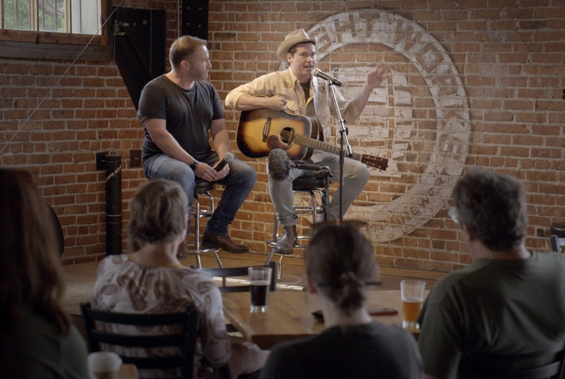 David Greene and Old Crow Medicine Show singer Ketch Decor on stage in Missoula, Montana, during the filming of the documentary, "Louder than Guns." (Courtesy of Louder than Guns)