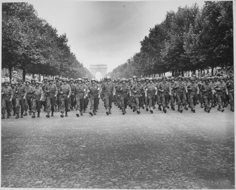 American troops of the 28th Infantry Division march down the Champs Elysees, Paris, in the `Victory' Parade." Poinsett, August 29, 1944. (Courtesy of the National Archives)