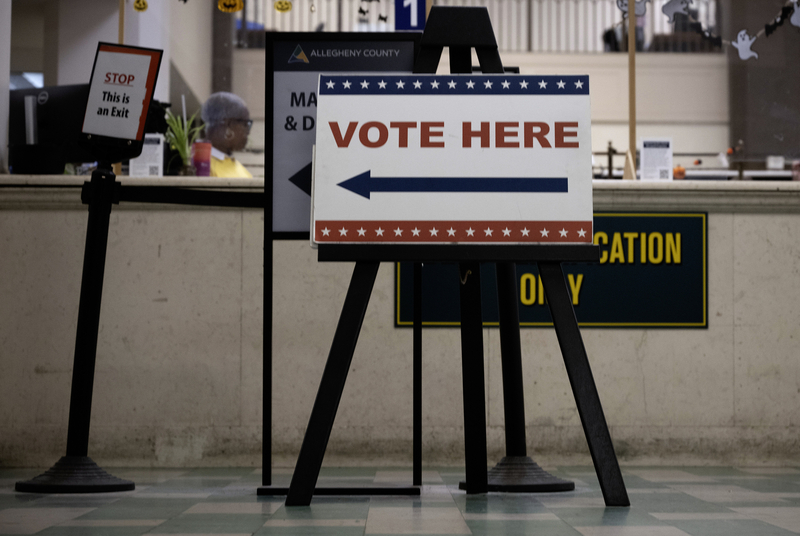 A sign directs voters to where they can cast their ballots at Allegheny County Election office in Pittsburgh Oct. 19, 2026. (Photo by John Beale/Pennsylvania Capital-Star)