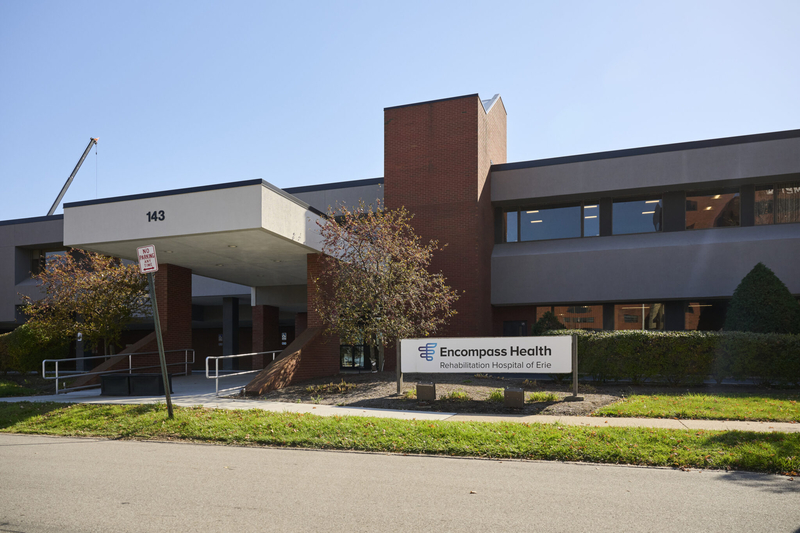 Encompass Health owns medical rehabilitation hospitals in 38 states, including this one in Erie, Pennsylvania, where Paul Webb Jr. went to recover from a brain bleed, a type of stroke. (Dustin Franz for KFF Health News) Photo shows exterior of Encompass Health facility.