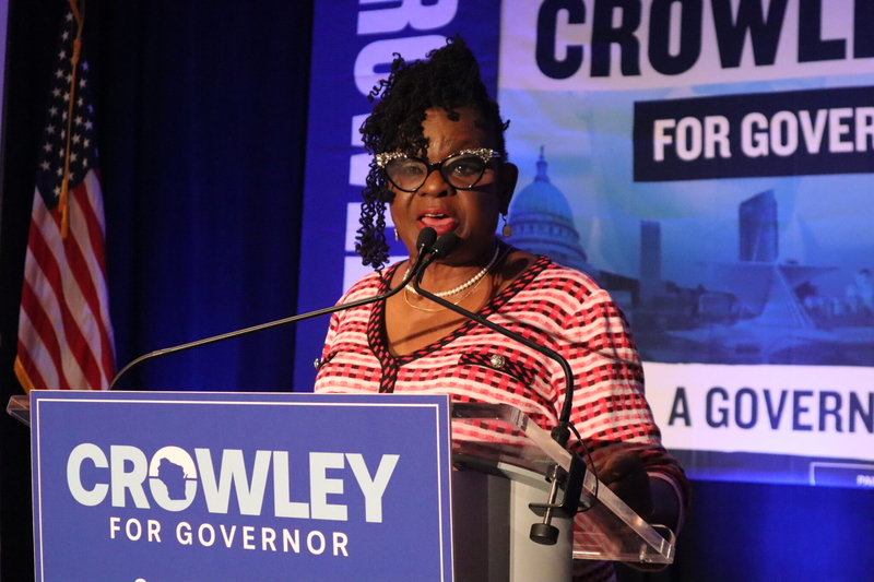 Congresswoman Gwen Moore addresses David Crowley's watch party audience after a election workers report a mistake in the flash drive downloads. (Photo by Isiah Holmes/Wisconsin Examiner)