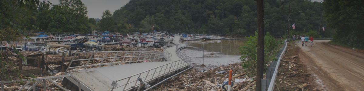 The Rocky Broad River flows into Lake Lure and overflows the town with debris from Chimney Rock, North Carolina, after heavy rains from Hurricane Helene on Sept. 28, 2024, in Lake Lure, North Carolina. Approximately 6 feet of debris piled on the bridge from Lake Lure to Chimney Rock, blocking access. (Photo by Melissa Sue Gerrits/Getty Images)